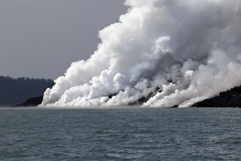 steam as lava enters sea